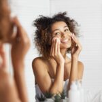 Young slim woman enjoys weight loss result