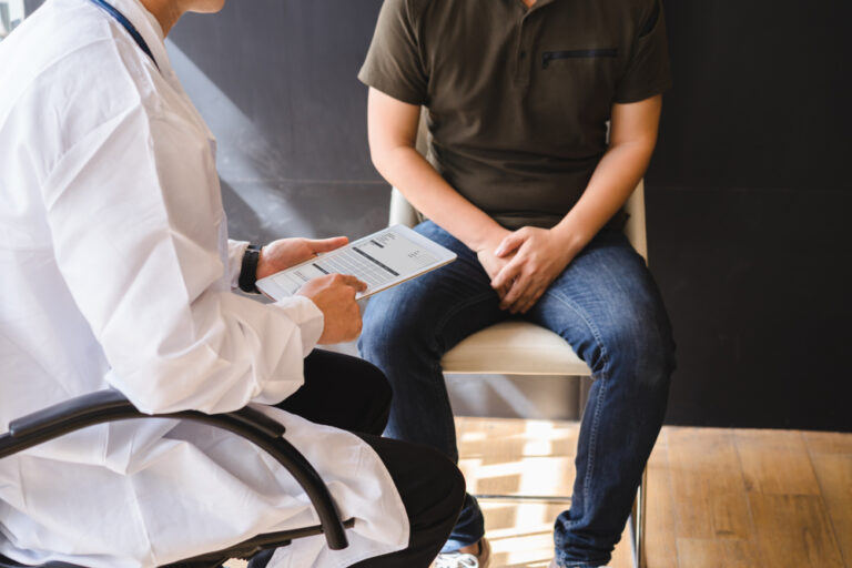 Male doctor patient are discussing about test report