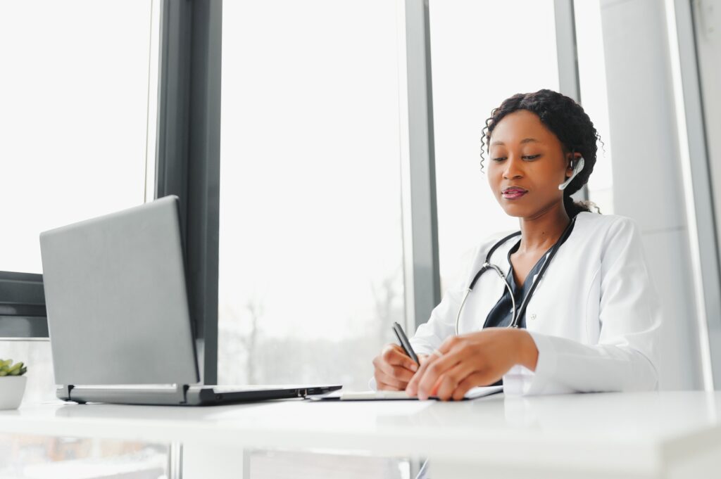 Telehealth, African American doctor in headset consulting with the patient